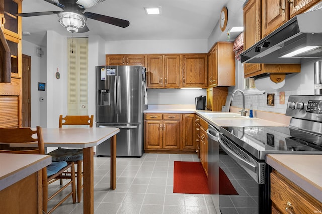 kitchen with ceiling fan, appliances with stainless steel finishes, and sink