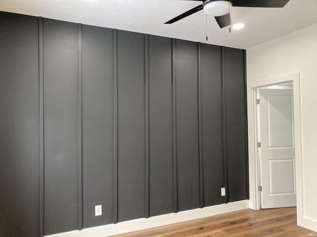 interior details featuring hardwood / wood-style flooring and ceiling fan