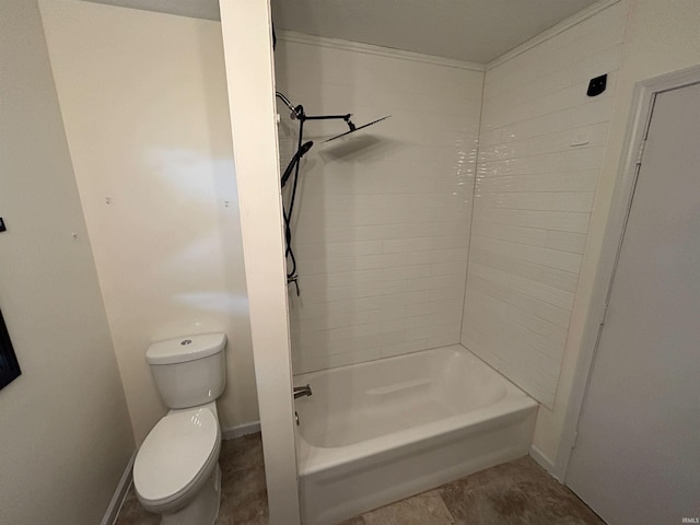 bathroom with shower / bathing tub combination and toilet