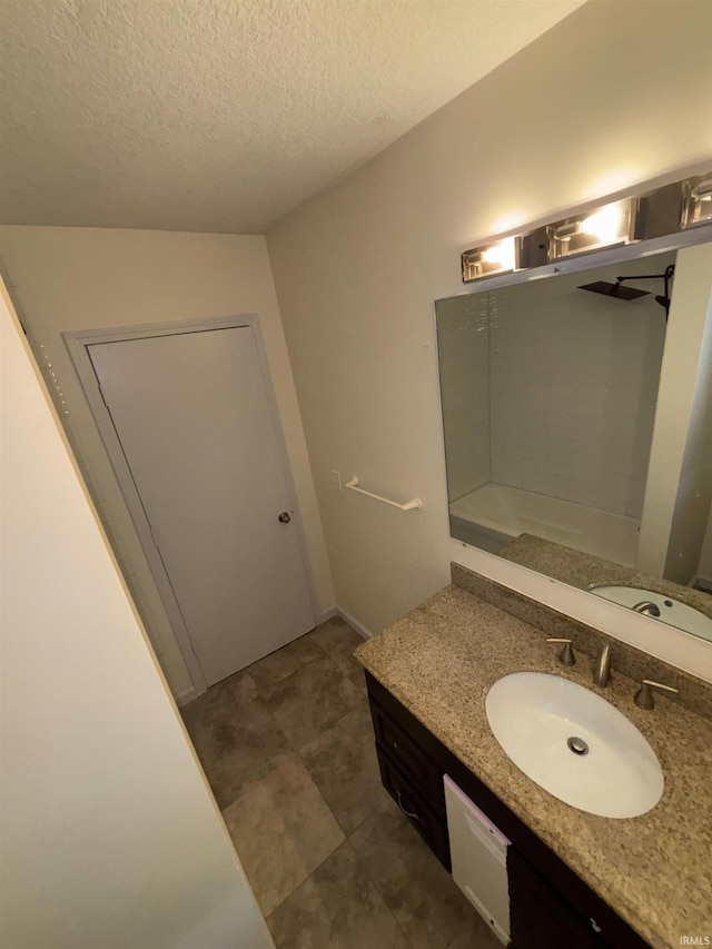 bathroom featuring vanity and a textured ceiling