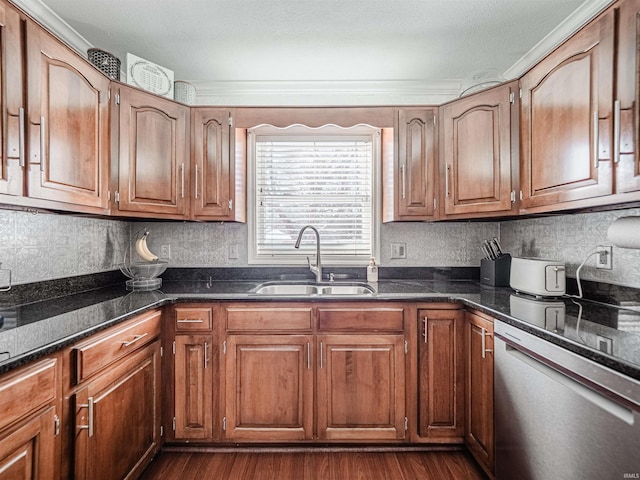 kitchen with sink, stainless steel dishwasher, dark wood-type flooring, and dark stone counters