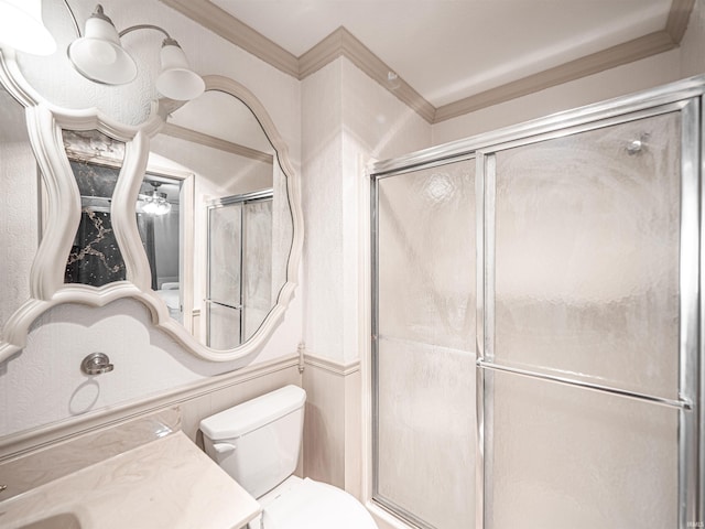 bathroom with vanity, toilet, and a shower with shower door