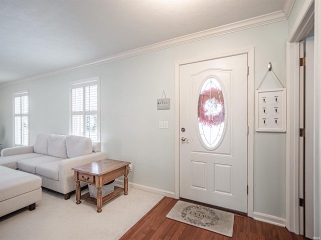 entrance foyer featuring hardwood / wood-style floors and crown molding