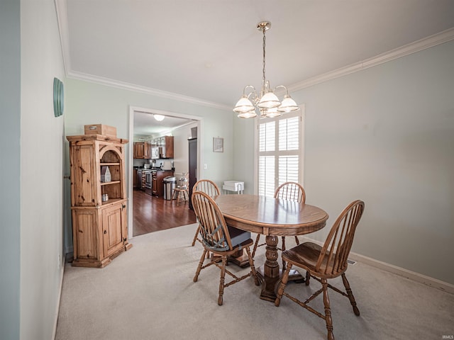 carpeted dining space featuring ornamental molding and a notable chandelier