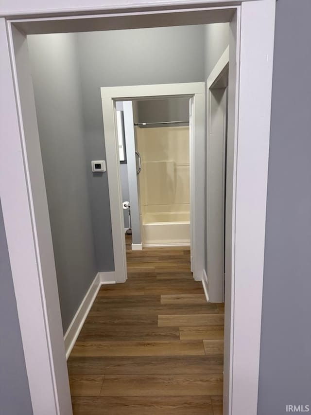 hall with dark hardwood / wood-style flooring