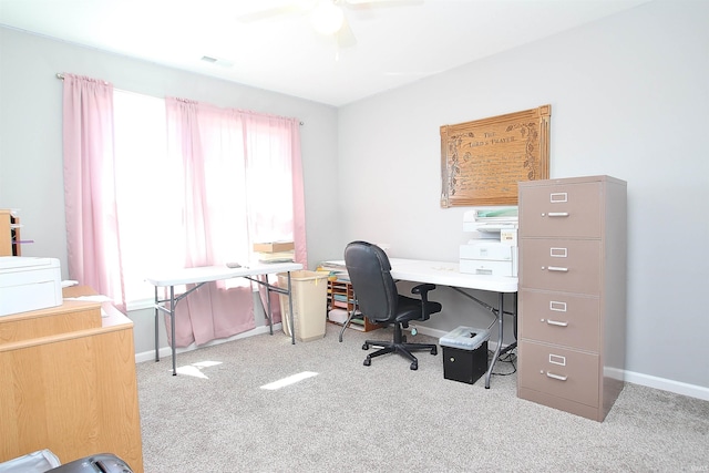 home office featuring ceiling fan and light carpet