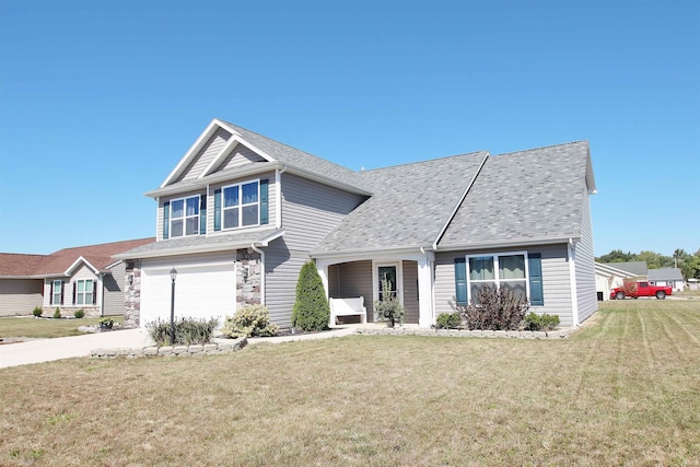 view of front facade with a garage and a front lawn