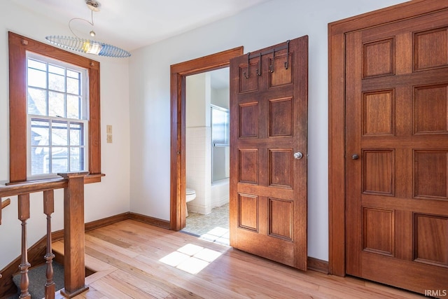 entrance foyer with light hardwood / wood-style flooring