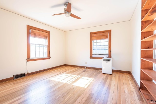 empty room featuring ceiling fan and light wood-type flooring