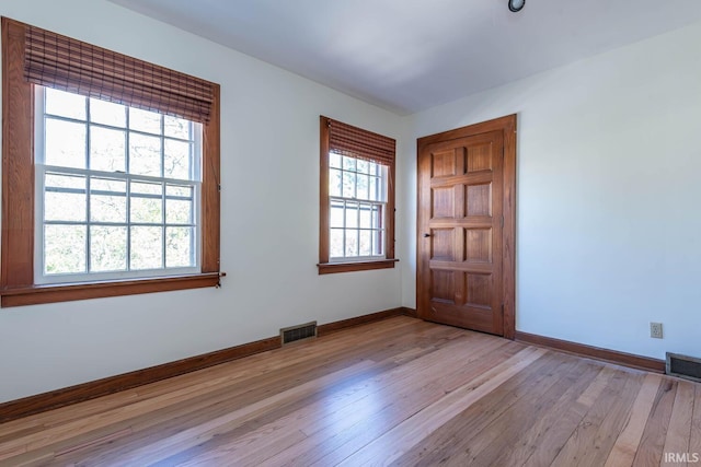 spare room with light wood-type flooring