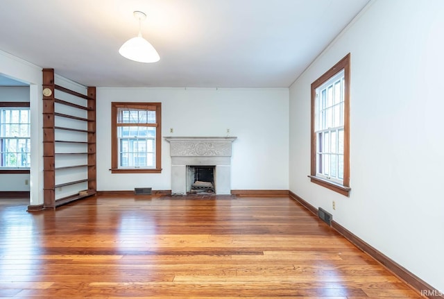 unfurnished living room with hardwood / wood-style floors