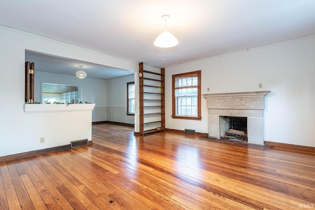 unfurnished living room featuring wood-type flooring