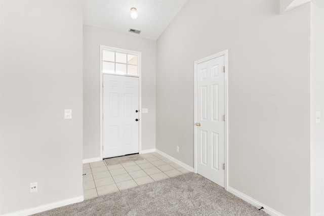 view of carpeted entrance foyer