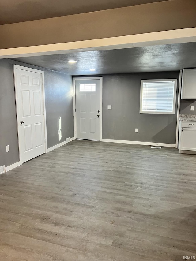 entryway with light hardwood / wood-style flooring