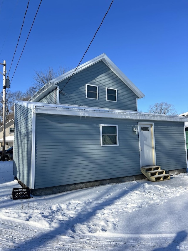 view of snow covered house