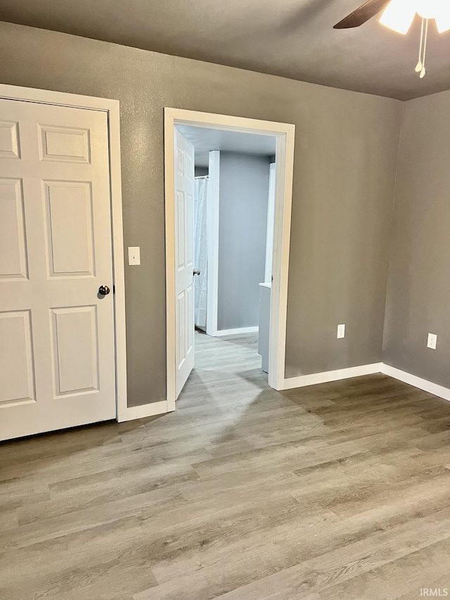 unfurnished room featuring ceiling fan and light hardwood / wood-style floors