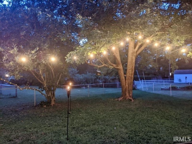 view of yard at night