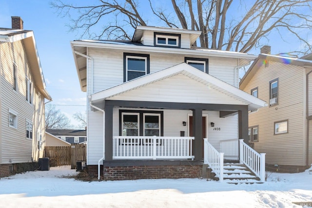 front of property featuring central AC and a porch