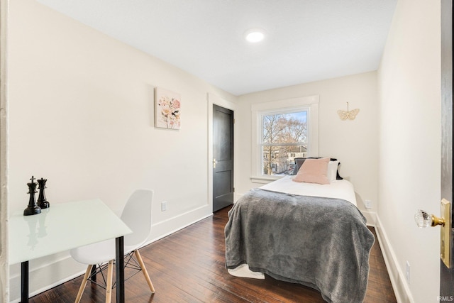 bedroom featuring dark hardwood / wood-style flooring