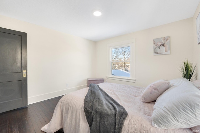 bedroom featuring dark hardwood / wood-style flooring