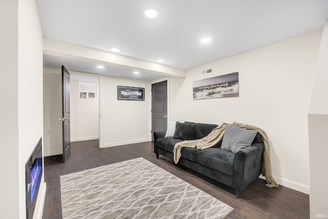 living room featuring dark hardwood / wood-style floors