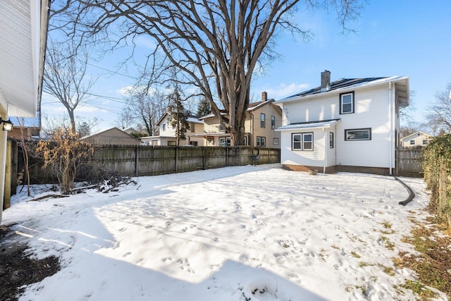 view of yard layered in snow