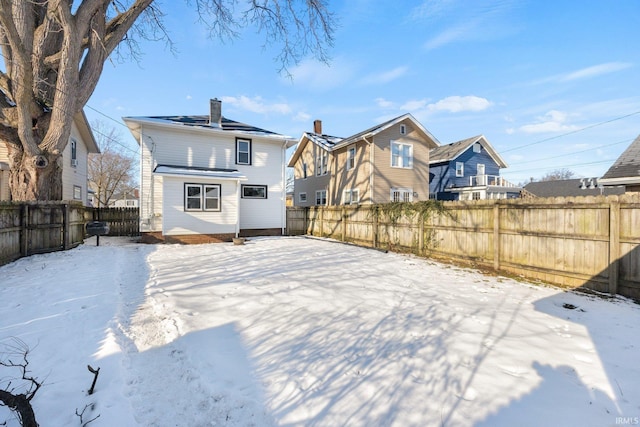 view of snow covered property