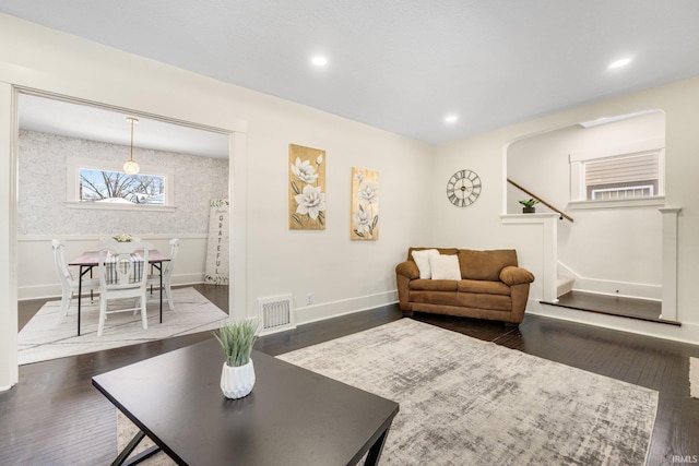 living room featuring dark hardwood / wood-style flooring