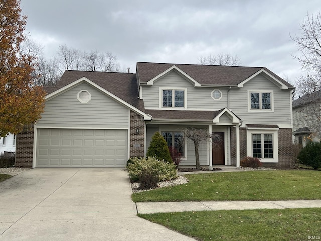 view of front of property featuring a garage and a front lawn