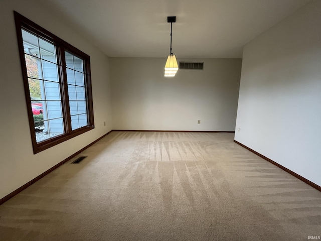 unfurnished dining area with carpet