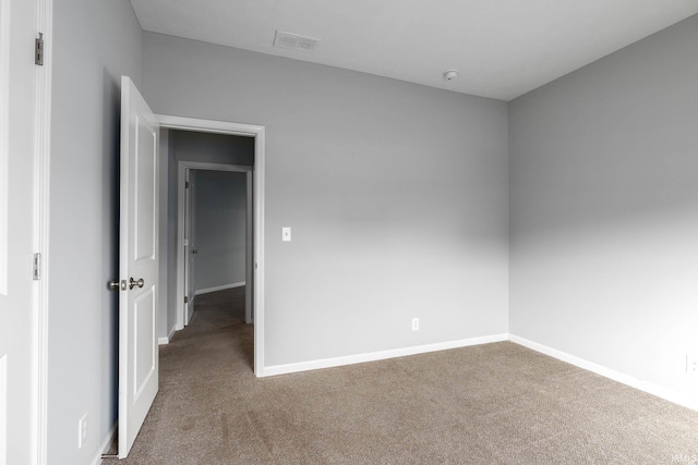 empty room with carpet flooring