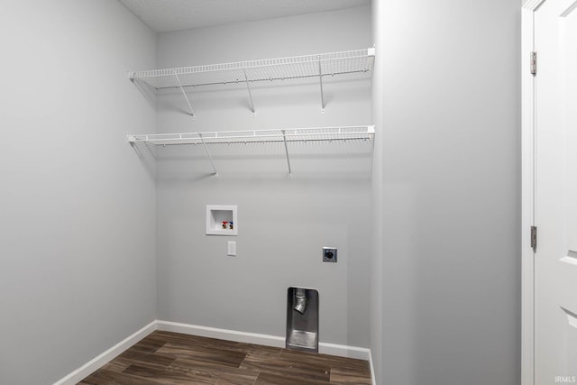 clothes washing area with electric dryer hookup, washer hookup, and dark hardwood / wood-style floors