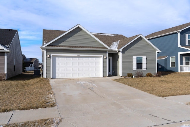 view of front facade with a garage and a front yard