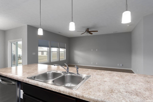 kitchen with sink, decorative light fixtures, stainless steel dishwasher, and ceiling fan