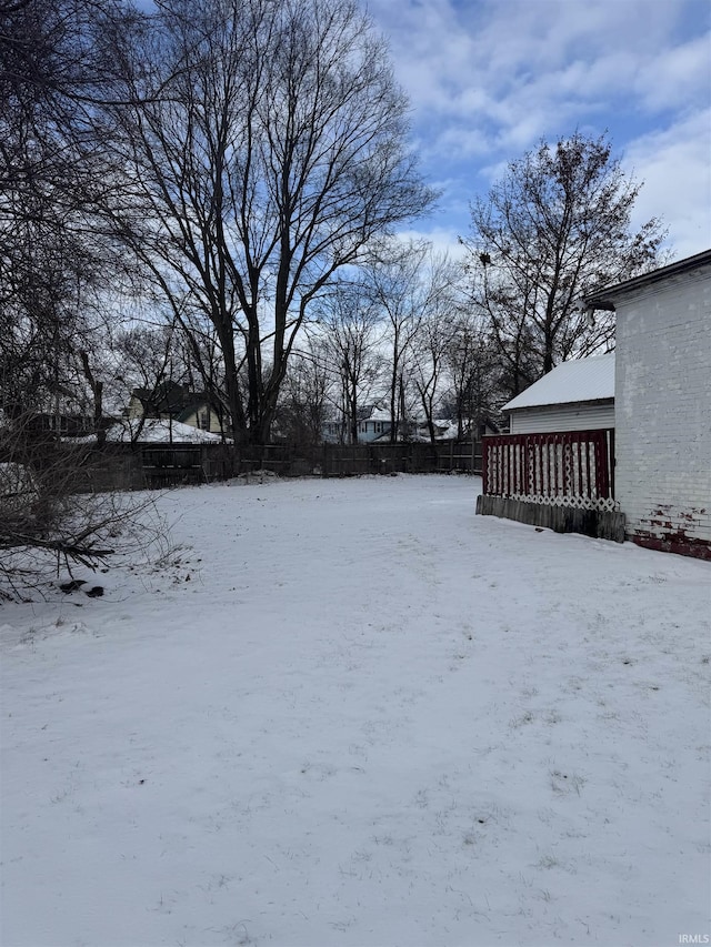 view of yard layered in snow