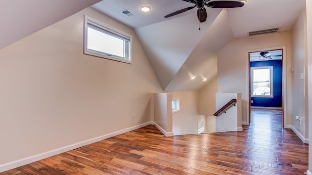 additional living space featuring vaulted ceiling, ceiling fan, and light hardwood / wood-style floors