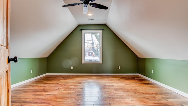 bonus room featuring vaulted ceiling, ceiling fan, and light hardwood / wood-style floors