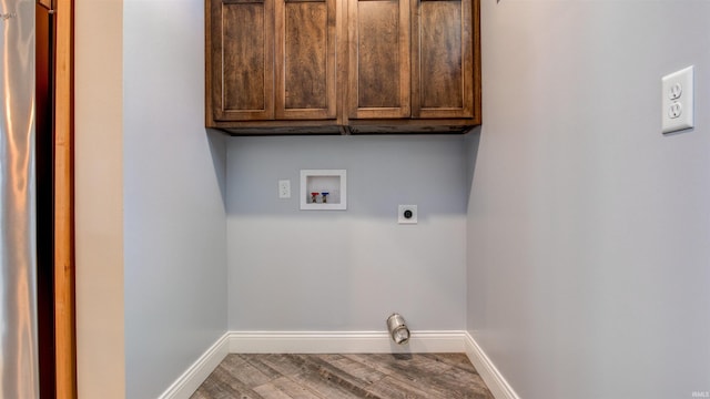 laundry room featuring cabinets, hookup for a washing machine, hookup for an electric dryer, and hardwood / wood-style flooring