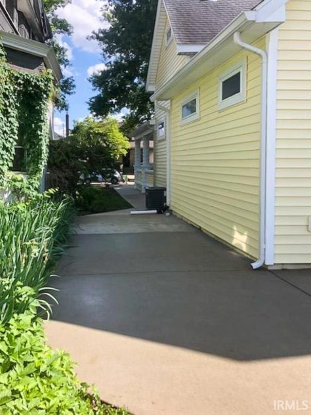 view of property exterior with a patio