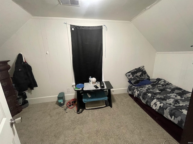 bedroom with vaulted ceiling and carpet flooring