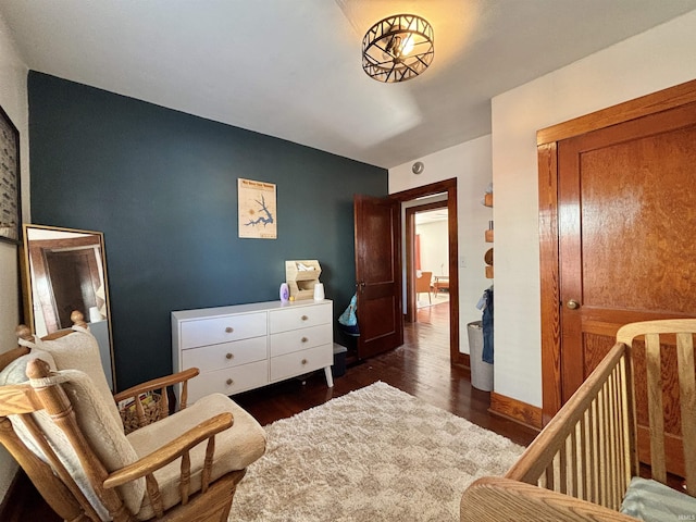 sitting room featuring dark wood-type flooring