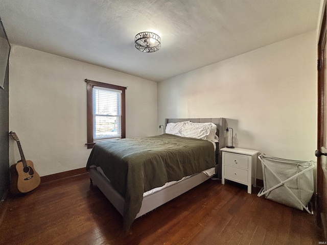 bedroom featuring dark hardwood / wood-style floors