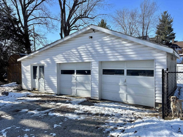 view of snow covered garage