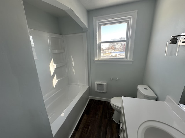 full bathroom with shower / washtub combination, hardwood / wood-style floors, vanity, and toilet