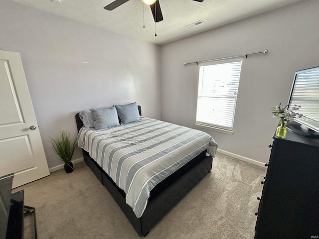 bedroom featuring ceiling fan and light colored carpet