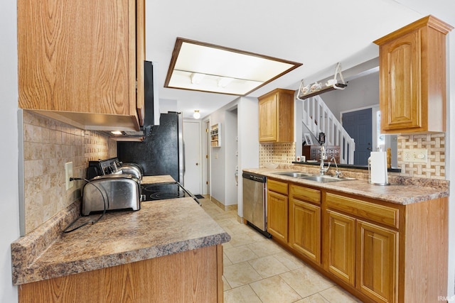 kitchen featuring light tile patterned floors, stainless steel appliances, sink, and backsplash