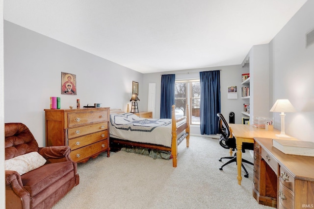 bedroom featuring light colored carpet