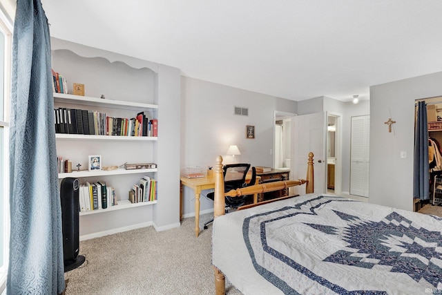 bedroom with light colored carpet and a closet