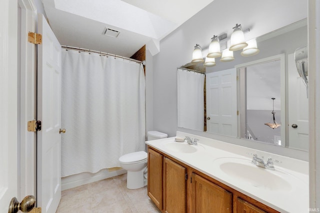 full bathroom featuring vanity, shower / bath combo, and toilet