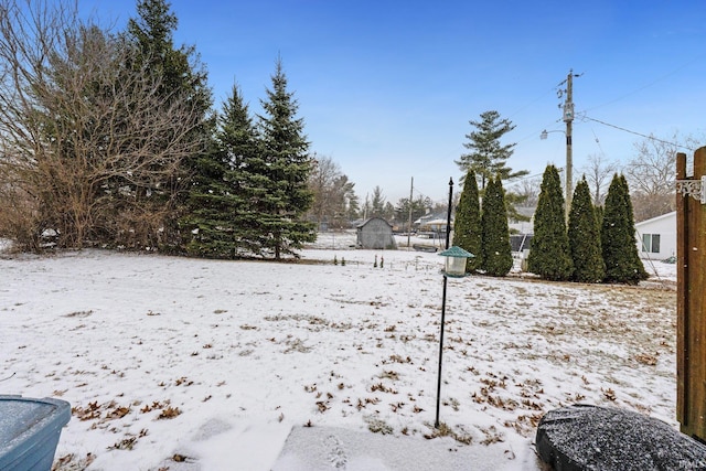 view of yard layered in snow